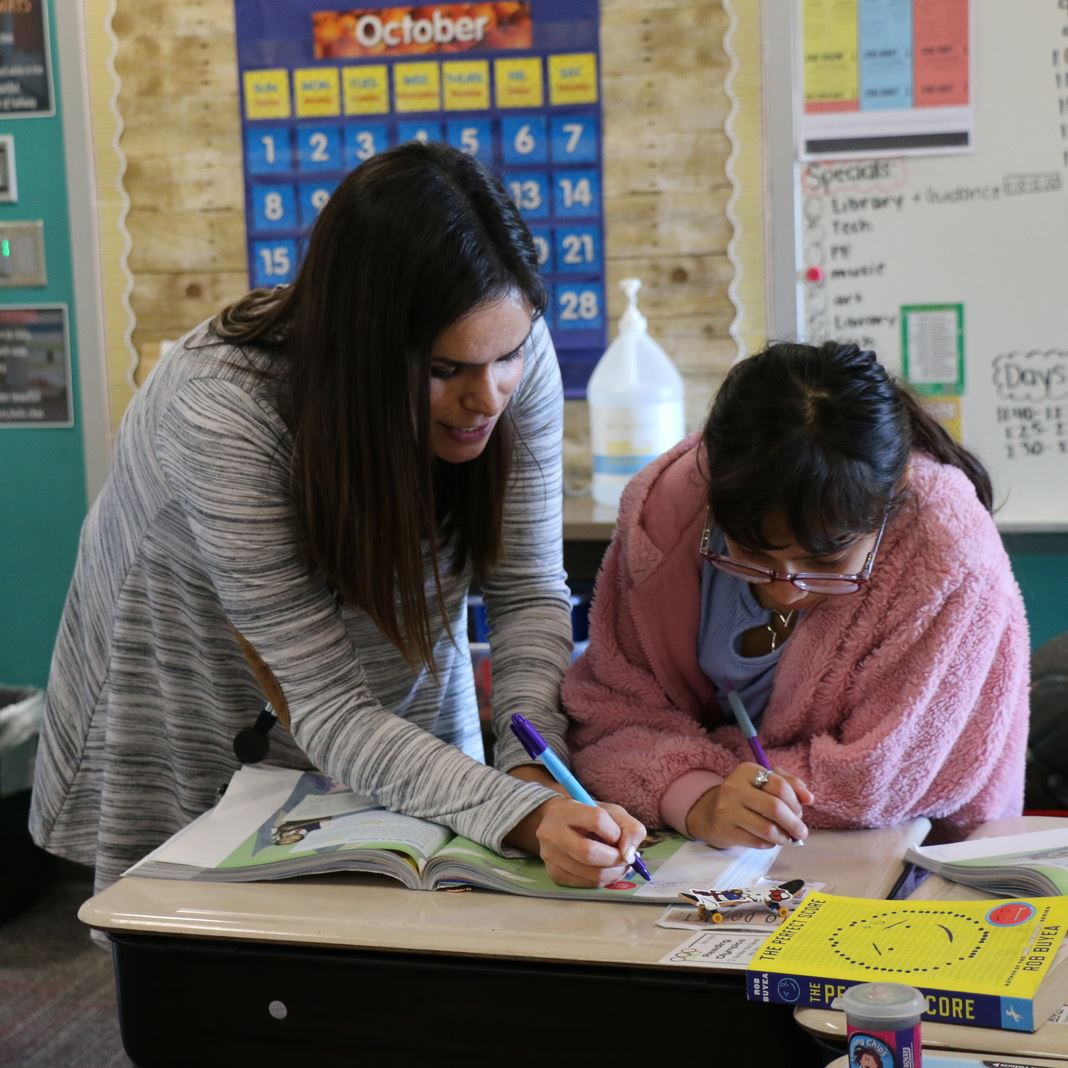 Donna Halford works with a student 